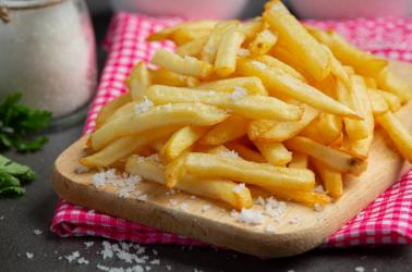 Crispy French fries with ketchup and mayonnaise.